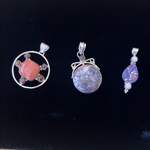 Three Elegant Silver and Stone pendants.